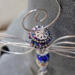 Handmade wire dragonfly ornament with bead details and a subtle celestial charm